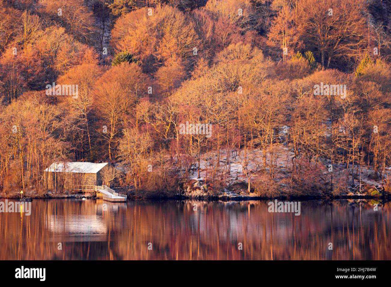 A boathouse on Windermere, with its reflection in the water, seen from Queen Adelaide's Hill Stock Photo
