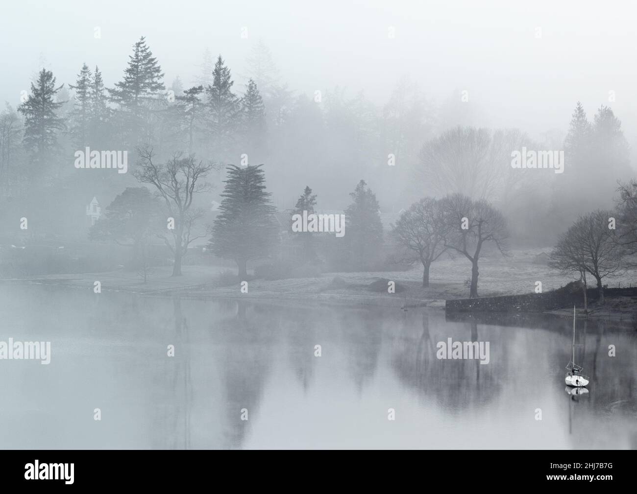 Misty morning reflections on Windermere from Queen Adelaide Hil Stock Photo
