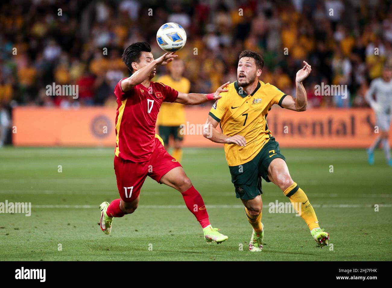 Melbourne, Australia, 27 January, 2022. Matthew Leckie of the Australian Socceroos and Van Thanh Vu of Vietnam  contest the ball during the World Cup Qualifier football match between Australia Socceroos and Vietnam. Credit: Dave Hewison/Speed Media/Alamy Live News Stock Photo