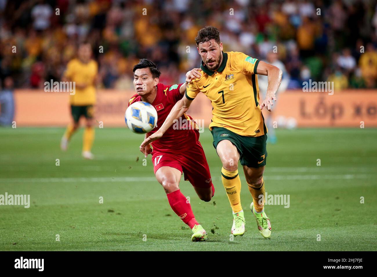 Melbourne, Australia, 27 January, 2022. Matthew Leckie of the Australian Socceroos and Van Thanh Vu of Vietnam  contest the ball during the World Cup Qualifier football match between Australia Socceroos and Vietnam. Credit: Dave Hewison/Speed Media/Alamy Live News Stock Photo