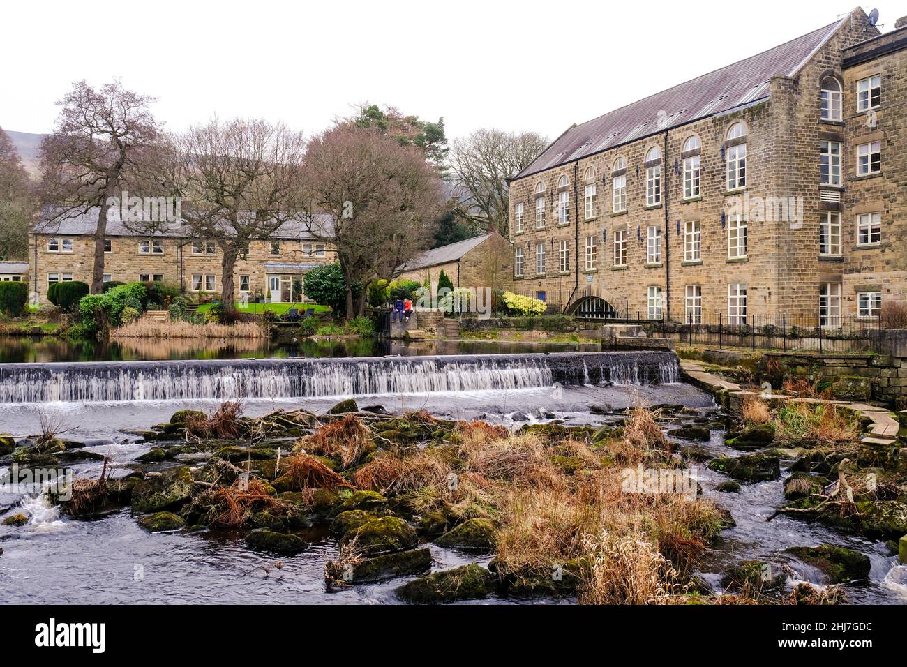 A view over the weir at Bamford Mill, Derbyshire Stock Photo