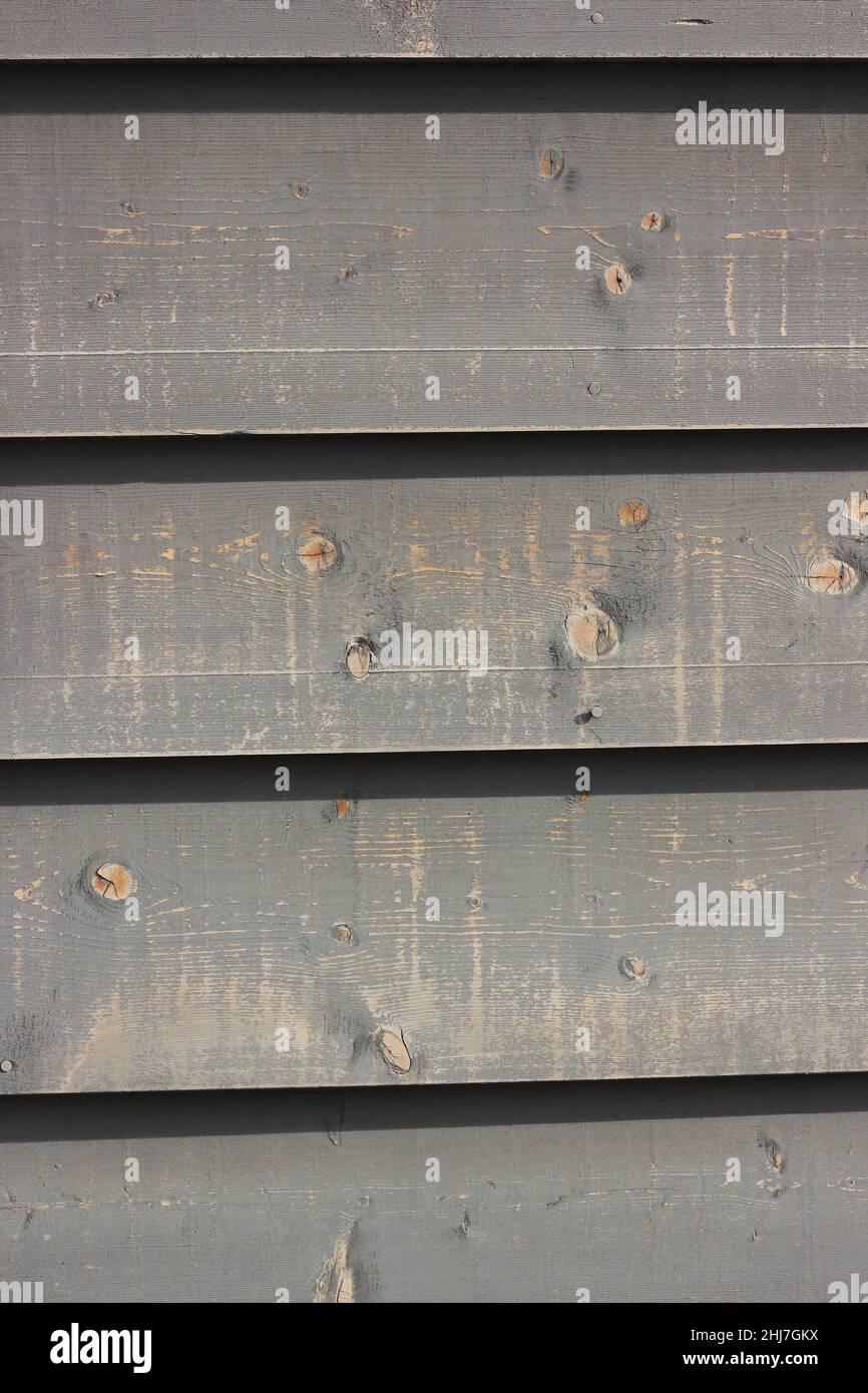 Wood planks and boards create house siding with old construction ...