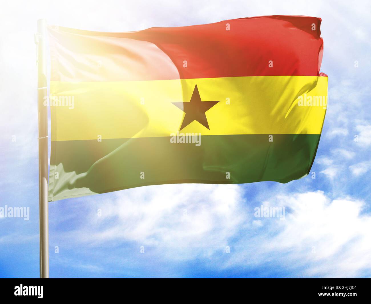 Flagpole with flag of Ghana. Stock Photo