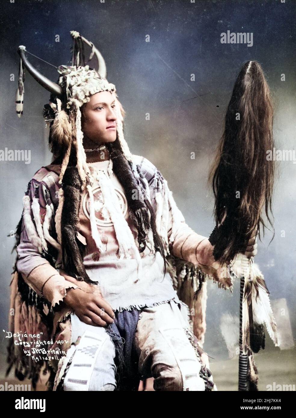 Defiance - Antique and vintage photo - Native american / Indian / American Indian. C 1902. Colorized vintage photo. Stock Photo