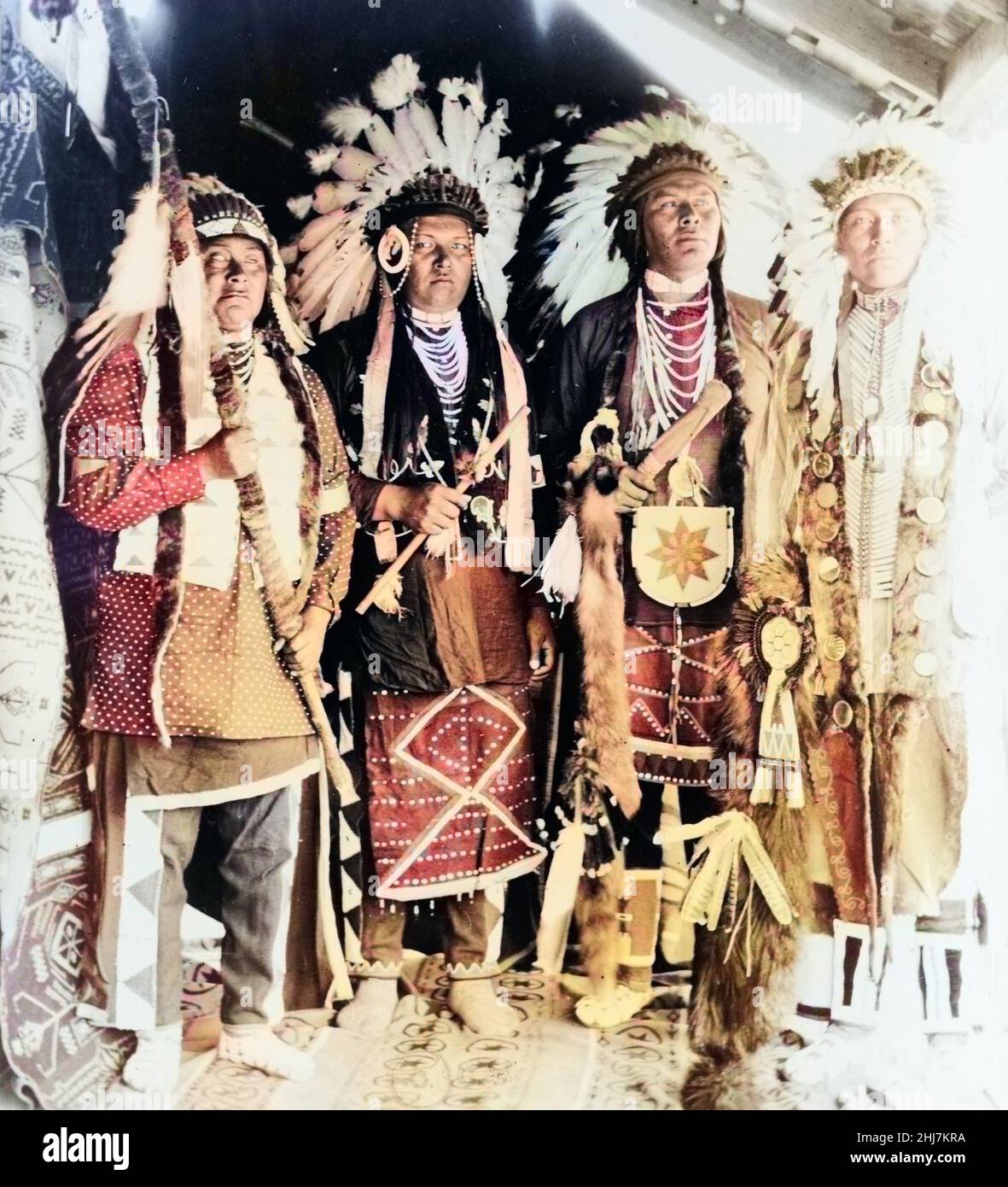 Four Nez Percé Indians, dressed for dance, on Colville Indian Reservation (native americans) c 1910. Photo by Clair Hunt. Colorized. Stock Photo