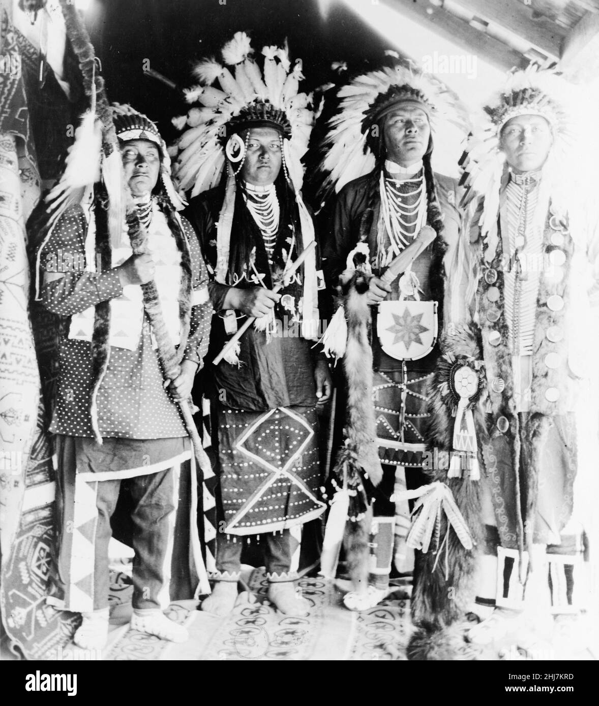 Four Nez Percé Indians, dressed for dance, on Colville Indian Reservation (native americans) c 1910. Photo by Clair Hunt. Stock Photo