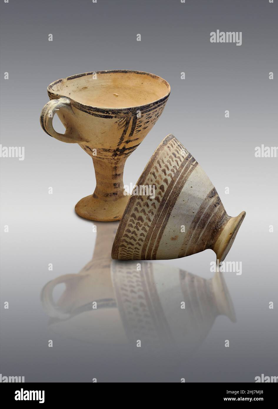 Mycenaean pottery . Cup with painted design, Barbouna area cist Graves, Asine, 1700-1600 BC. Nafplion Archaeological Museum. Against grey background. Stock Photo