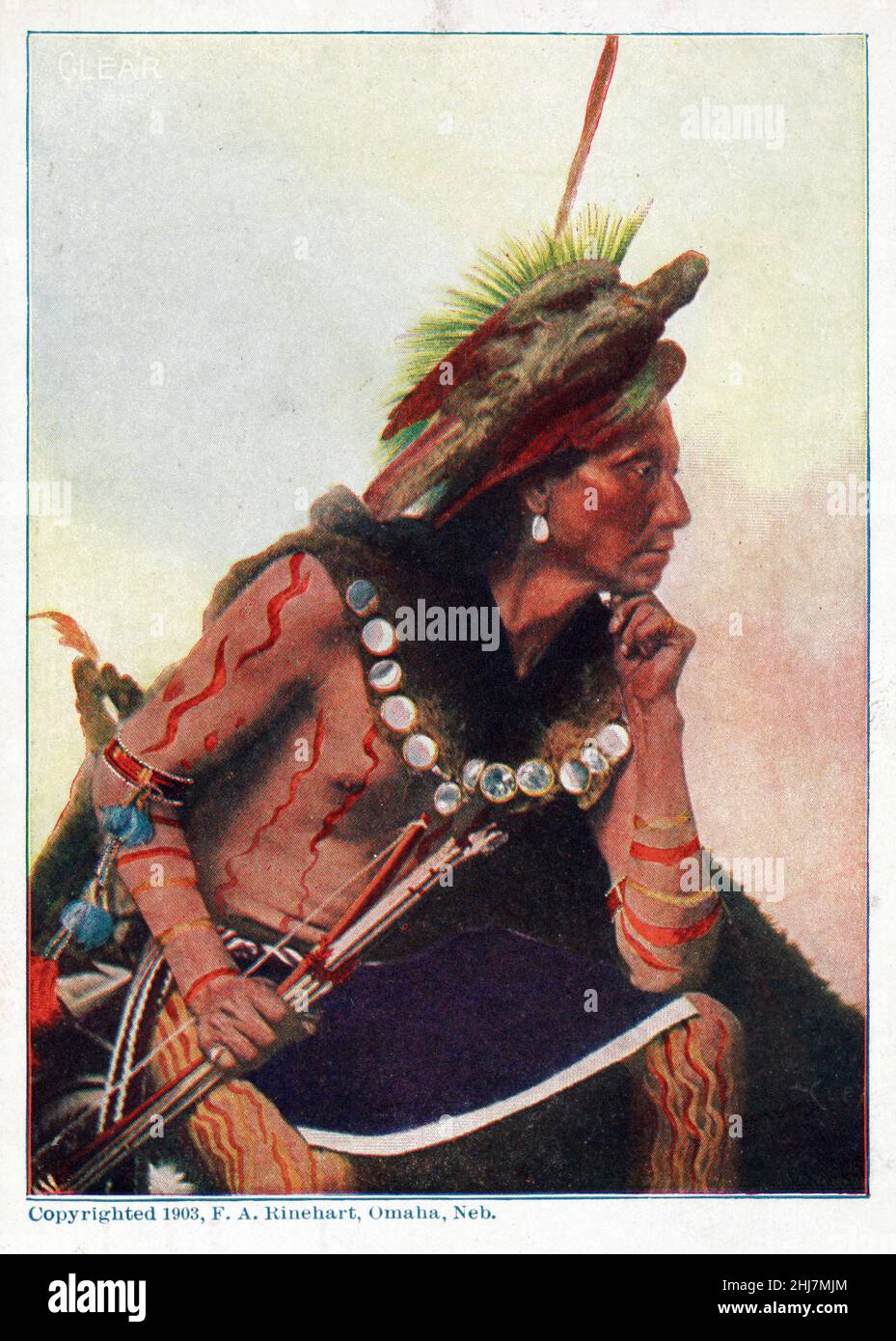 American Indian, seated, holding bow and arrow, wearing body paint and a bird headress, Omaha, Nebraska. Photo by F. A. Rinehart, 1903. Stock Photo
