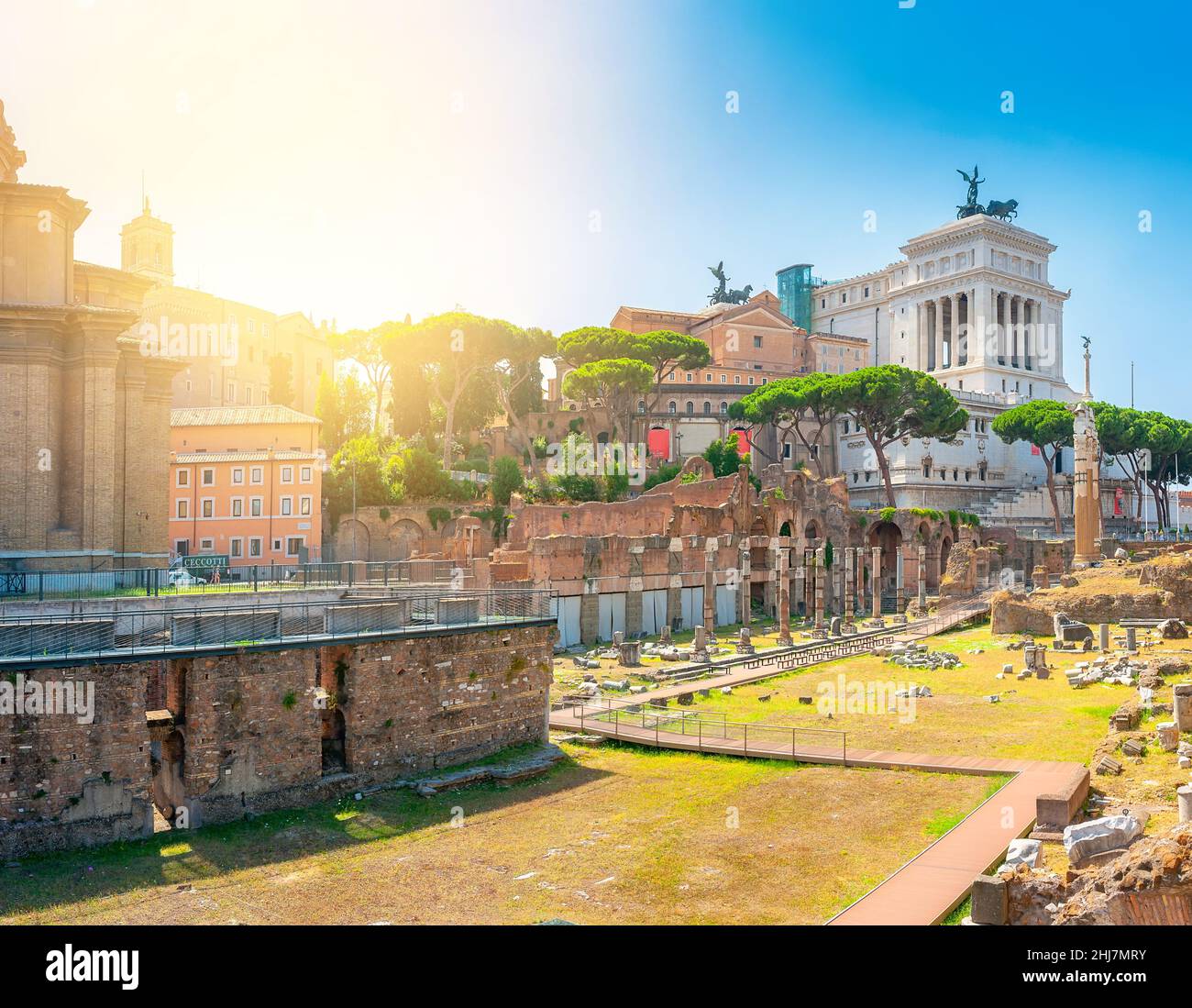 Panorama of the ruins of the ancient Roman forum at sunset, the most important place of ancient Rome. Antique architecture of Rome. above famous archi Stock Photo