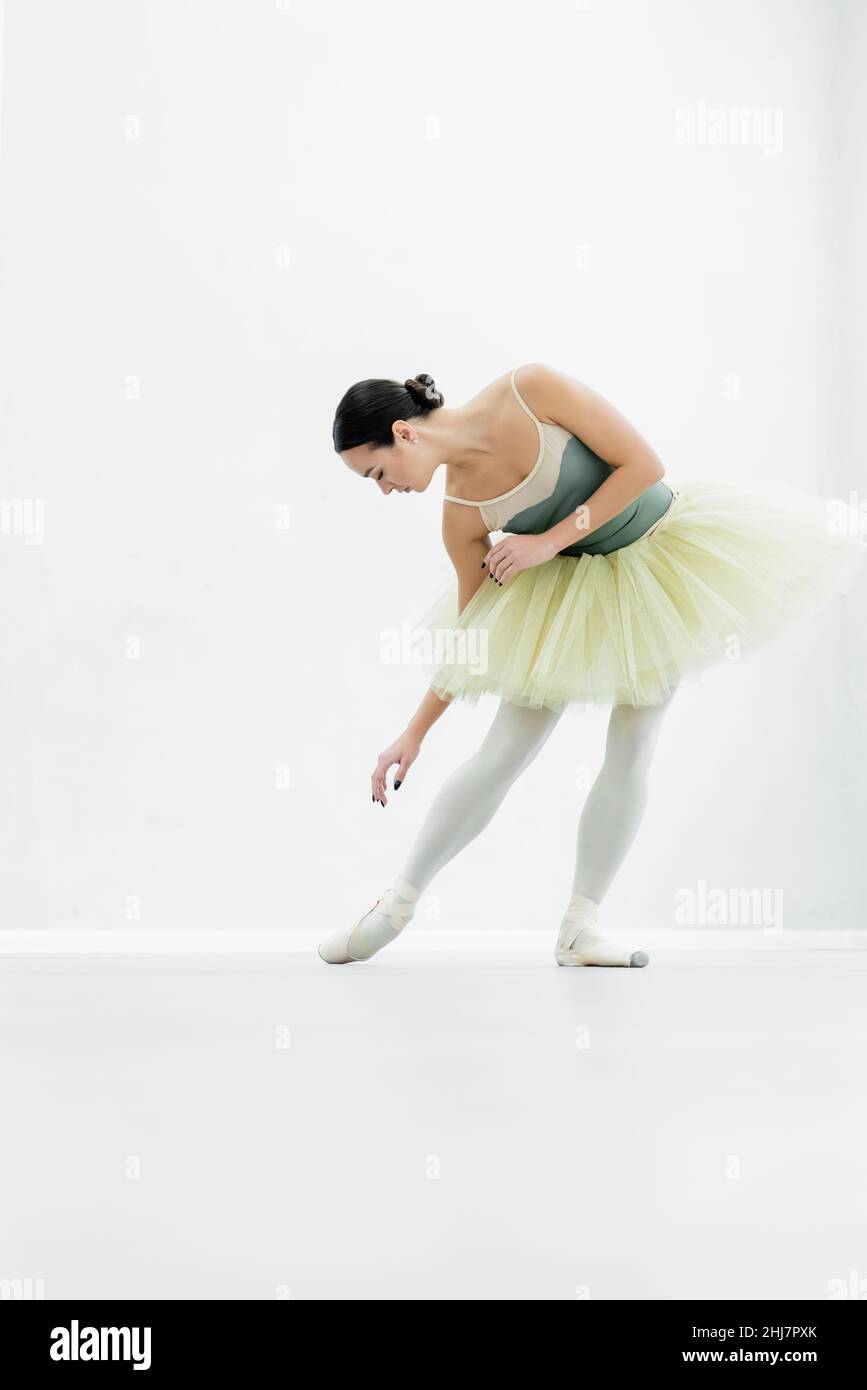 young ballerina practicing choreographic elements during repetition Stock Photo