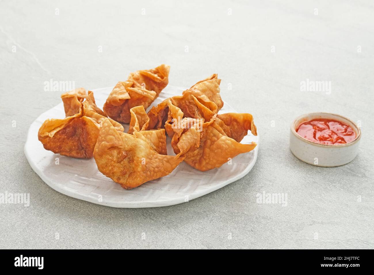 Pangsit, Pangsit Goreng, Delicious Pangsit Ayam Goreng (Chicken Fried Dumpling), Indonesian Traditional Food made from flour and chicken. Stock Photo