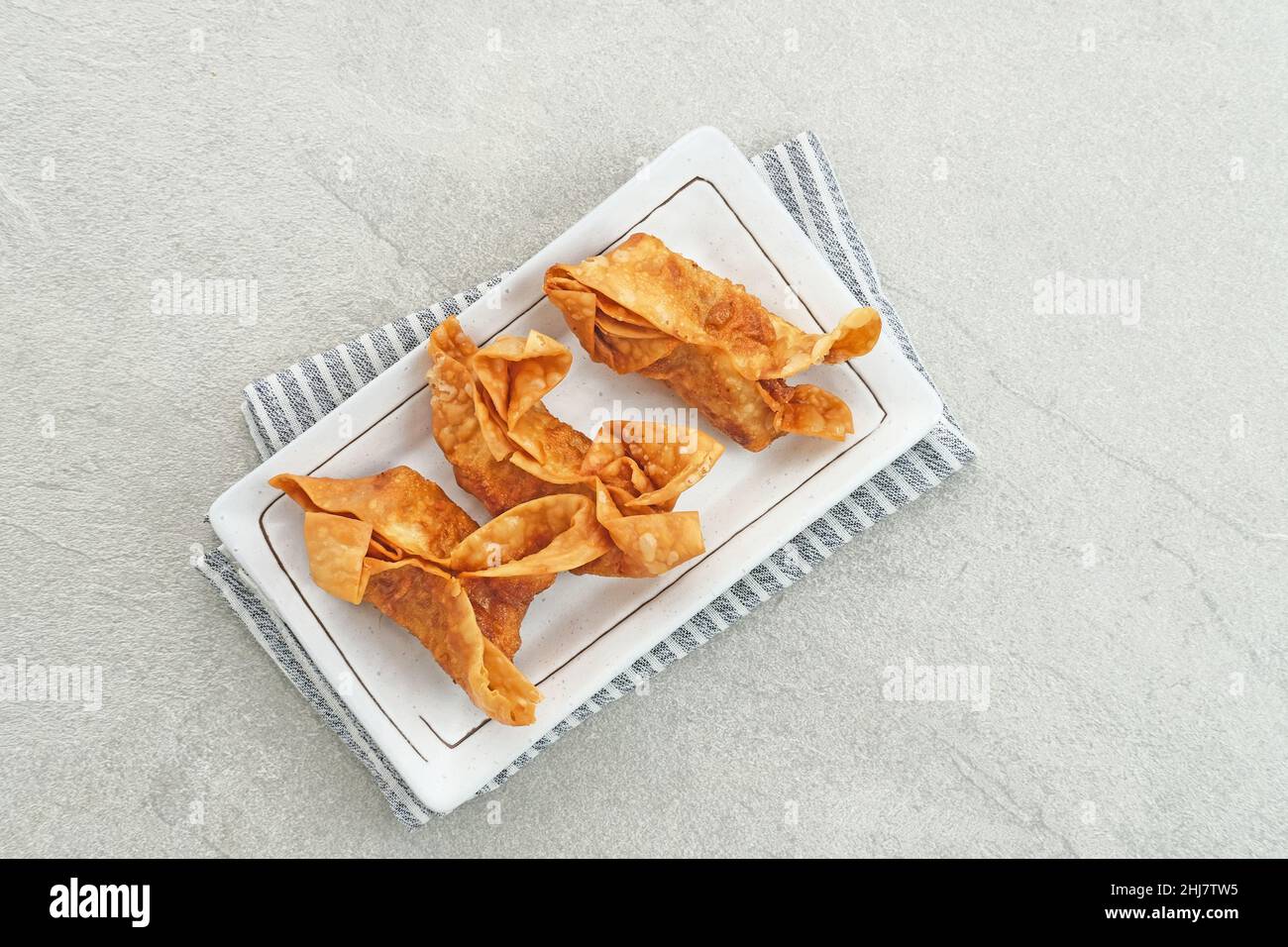 Pangsit, Pangsit Goreng, Delicious Pangsit Ayam Goreng (Chicken Fried Dumpling), Indonesian Traditional Food made from flour and chicken. Stock Photo