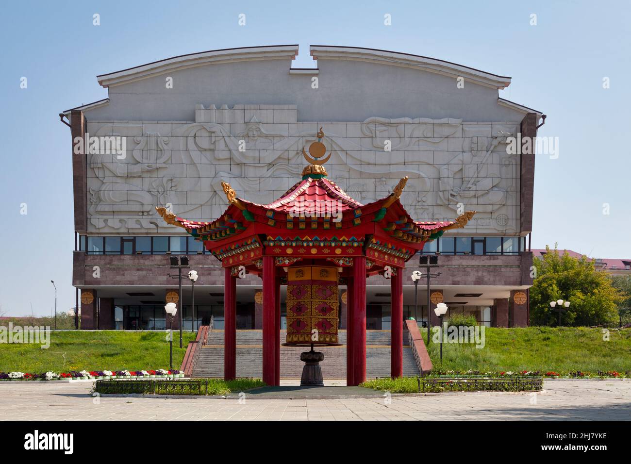 Ulan-Ude, Russia - July 29 2018: Spinning Buddhist prayer wheel opposite the Buryat State Academic Drama Theater. H. Namsaraeva. Stock Photo