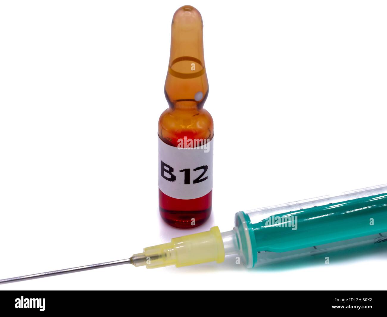B12 ampoule with syringe isolated Stock Photo