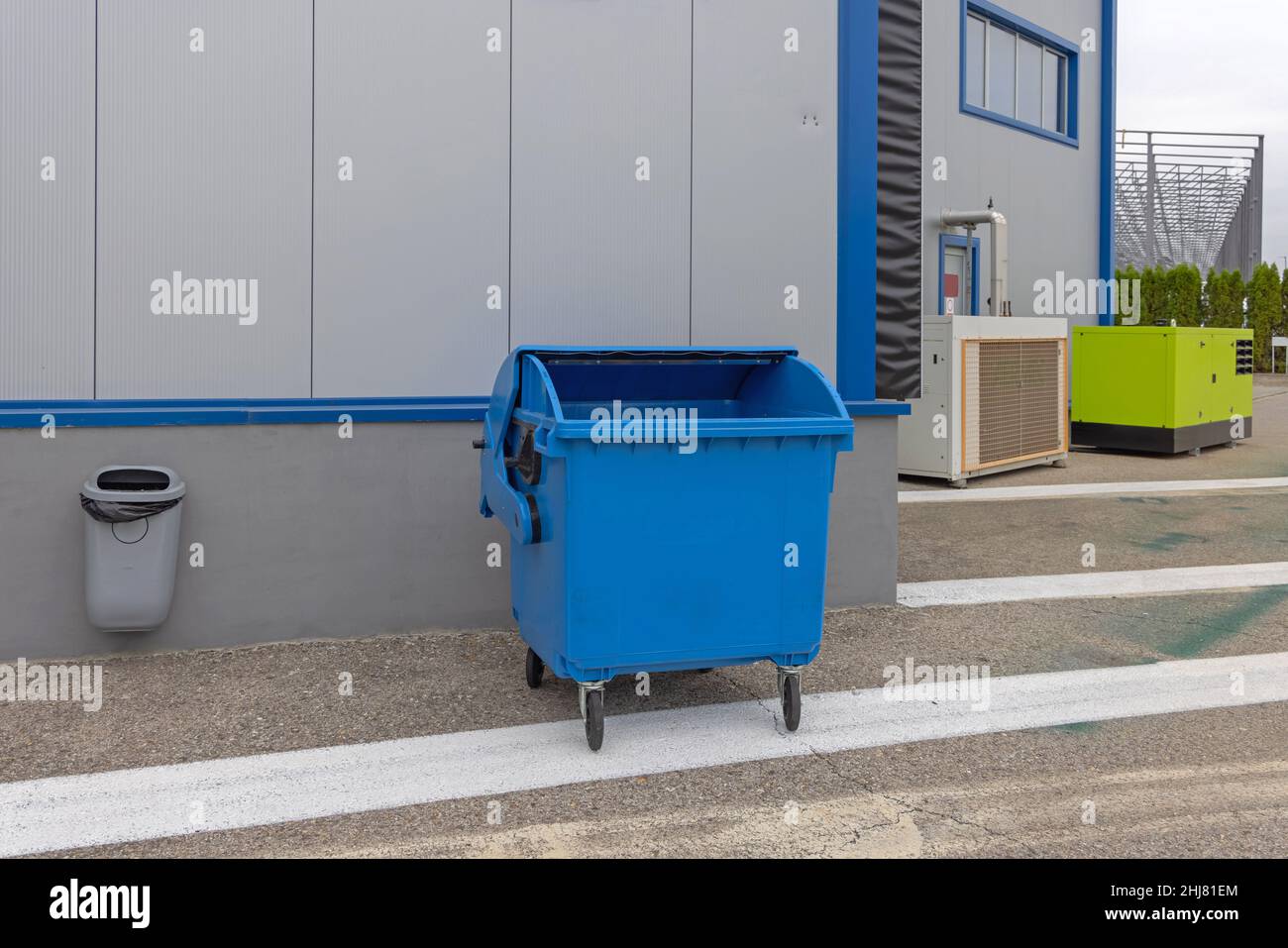 Hanging Trash Bin and Blue Wheeled Dumpster Recycling Warehouse Stock