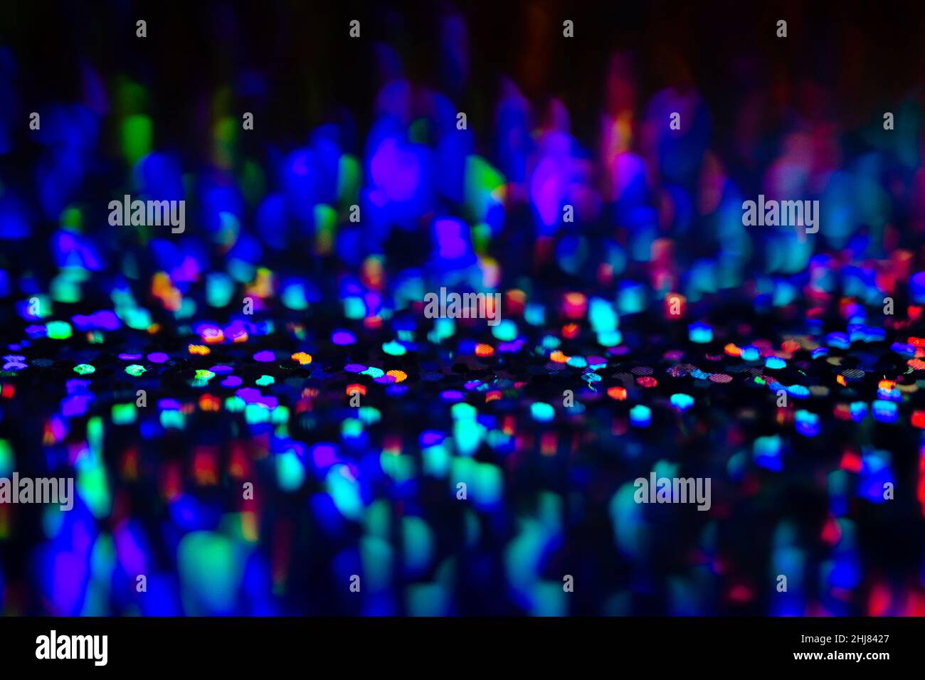 Neon rainbow glittering lights with glow effect abstract background Stock Photo