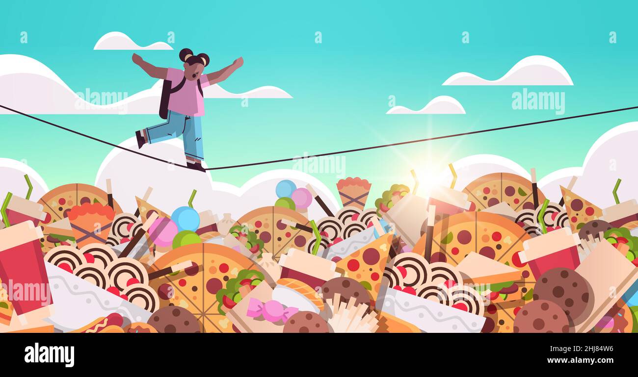 Food Save Rope schoolgirl balancing on rope above junk food assortment of fast food ...