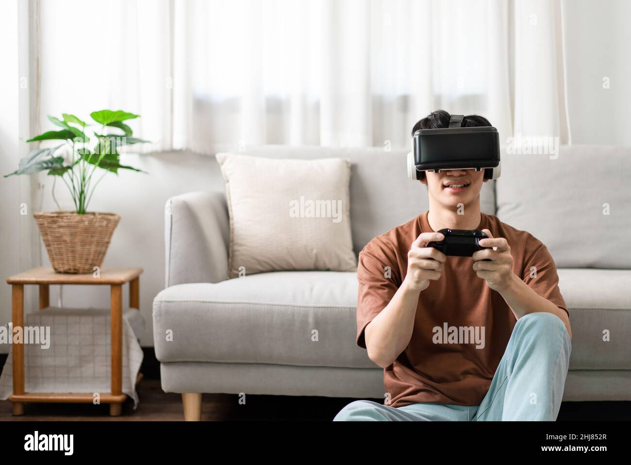 Technology Concept A man putting on a virtual reality headset and ...
