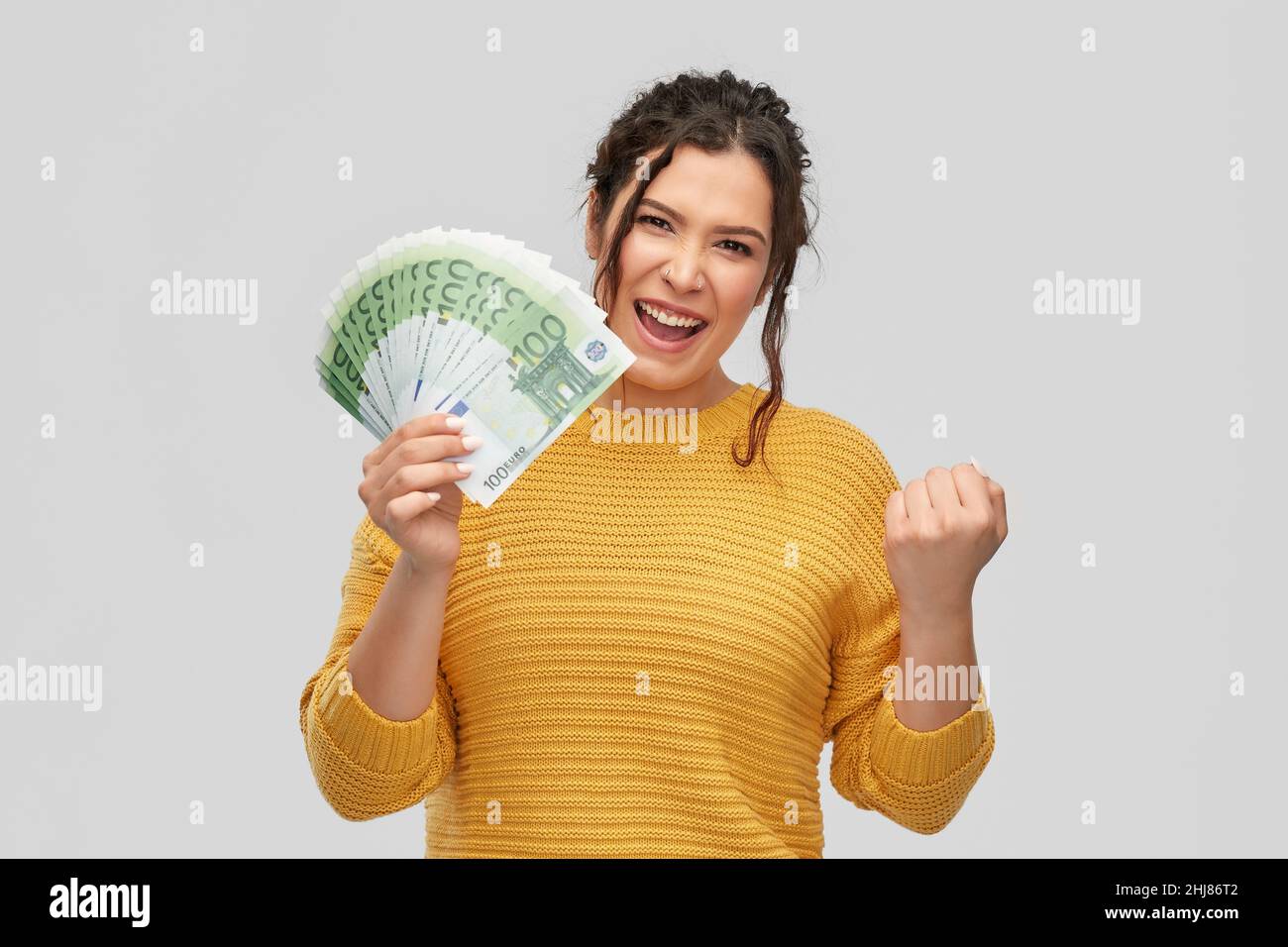 Woman smiling fist pump hi-res stock photography and images - Alamy