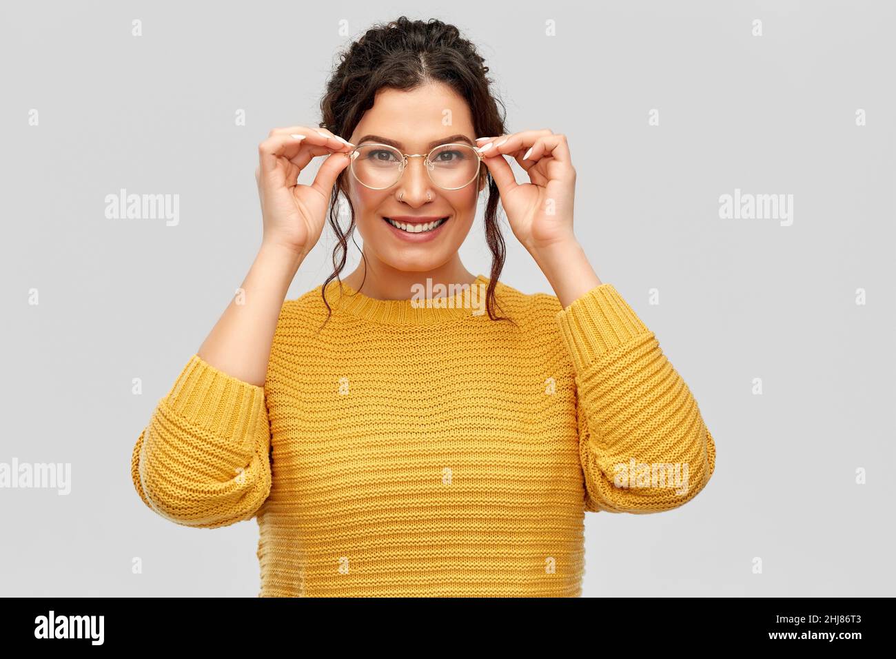 happy smiling young woman in glasses Stock Photo