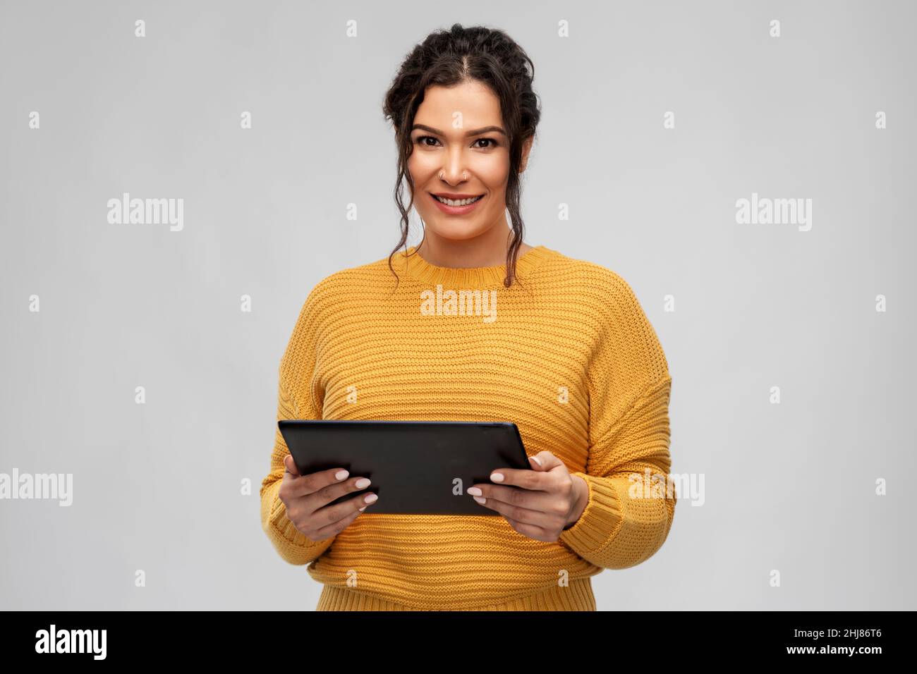happy young woman using tablet pc computer Stock Photo