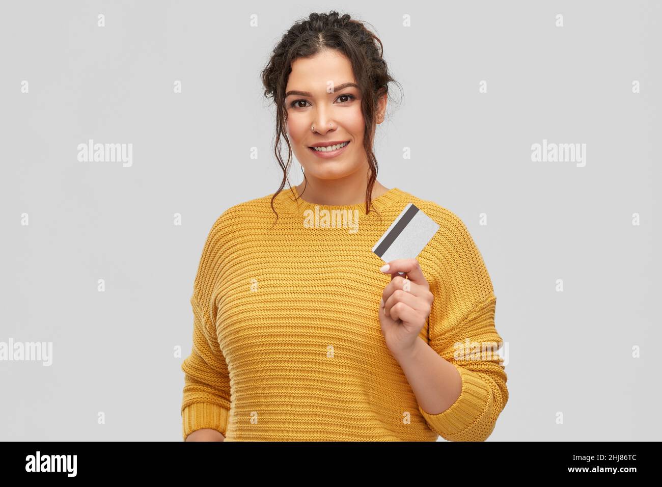 happy smiling young woman with credit card Stock Photo