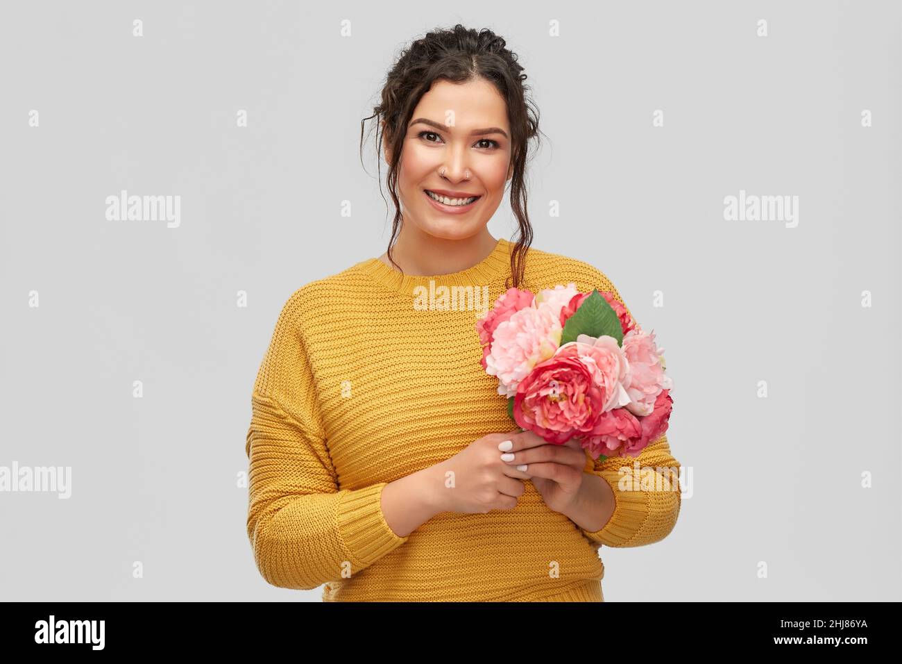 happy smiling young woman with bunch of flowers Stock Photo - Alamy