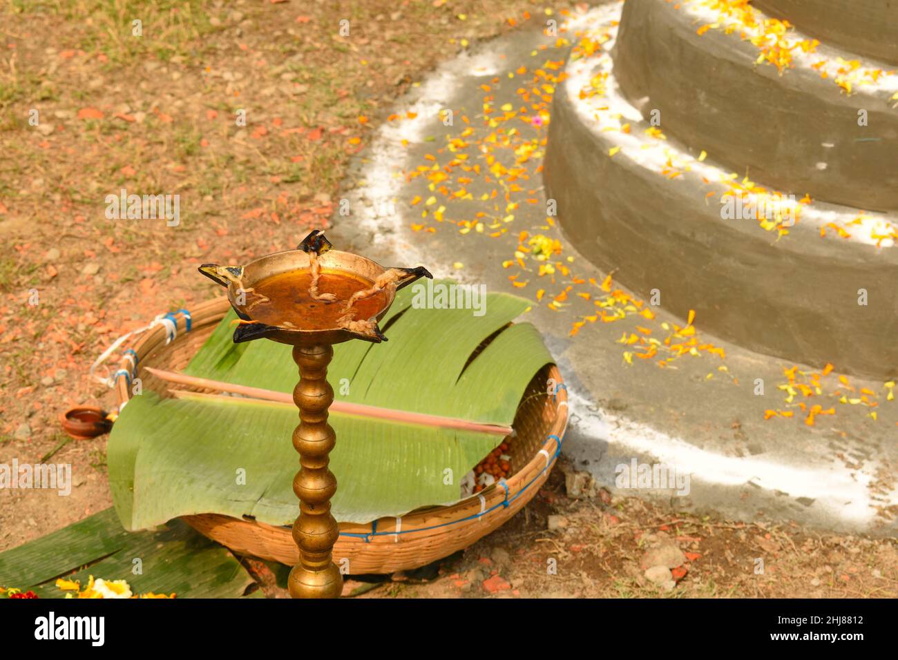 Oil lamp lighted during day time. An oil lamp is an object used to
