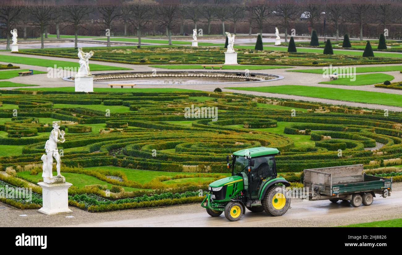 Hanover, Germany. 27th Jan, 2022. A gardener drives through the Great Garden of the Herrenhäuser Gardens. Credit: Julian Stratenschulte/dpa/Alamy Live News Stock Photo