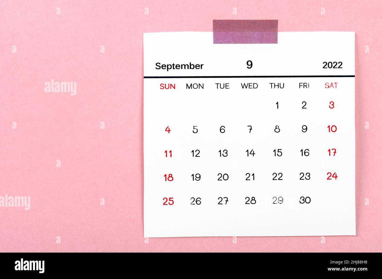 The September 2022 calendar on pink background. Stock Photo
