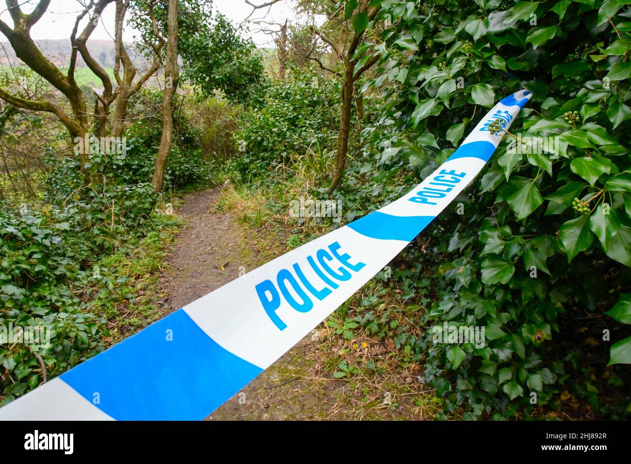 Bothenhampton, Bridport, Dorset, UK.  27th January 2022.  General view of police cordon tape at Bothenhampton Nature Reserve near Bridport in Dorset where the bodies of two teenager were found dead on the morning of Tuesday 25th January.  Picture Credit: Graham Hunt/Alamy Live News Stock Photo
