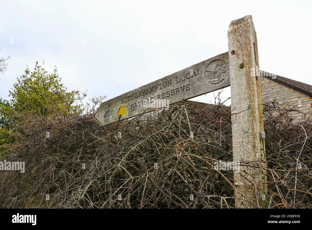 Bothenhampton, Bridport, Dorset, UK.  27th January 2022.  General view of a signpost pointing to Bothenhampton Nature Reserve near Bridport in Dorset where the bodies of two teenager were found dead on the morning of Tuesday 25th January.  Picture Credit: Graham Hunt/Alamy Live News Stock Photo