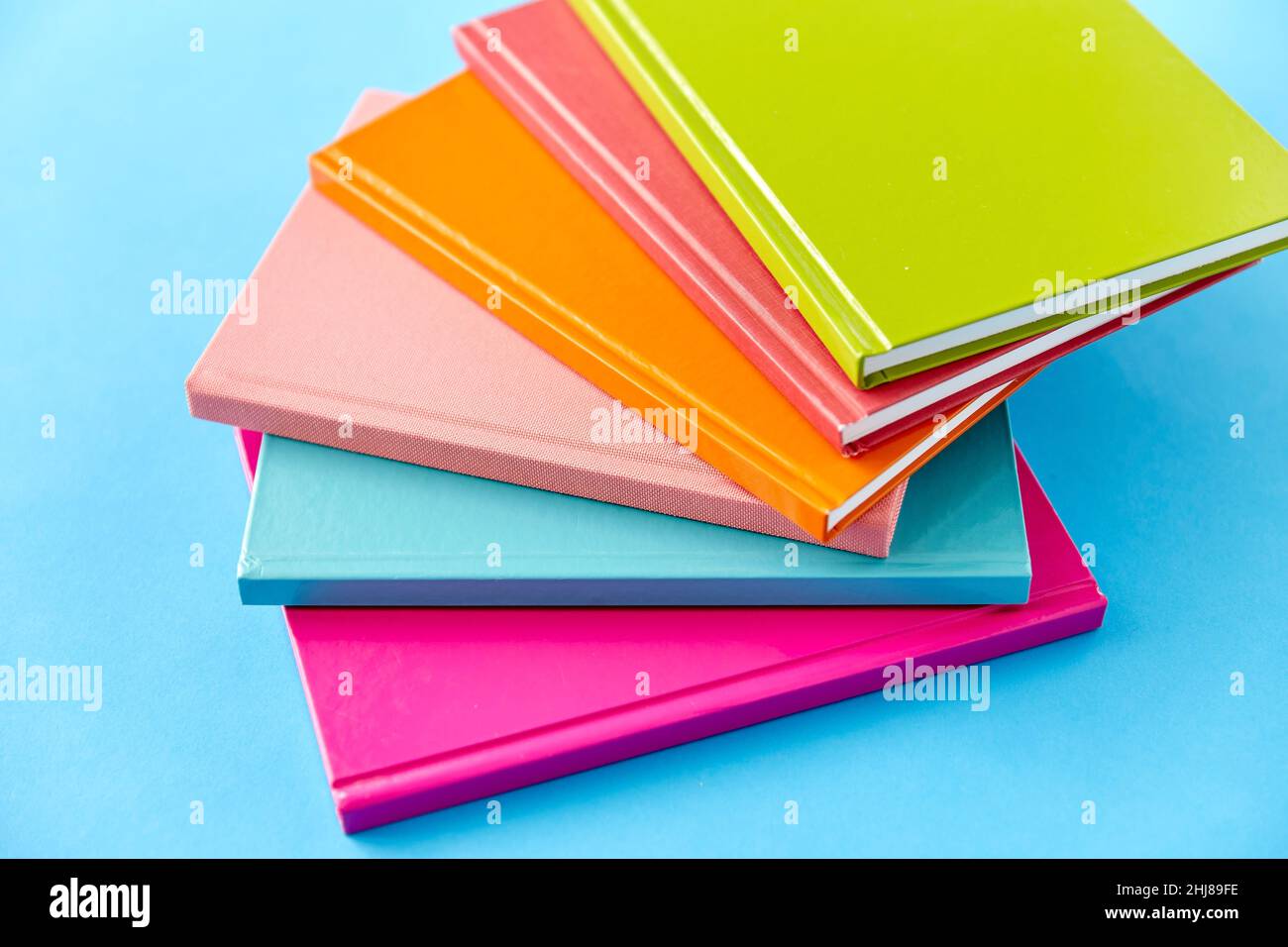 notebooks or books on blue background Stock Photo