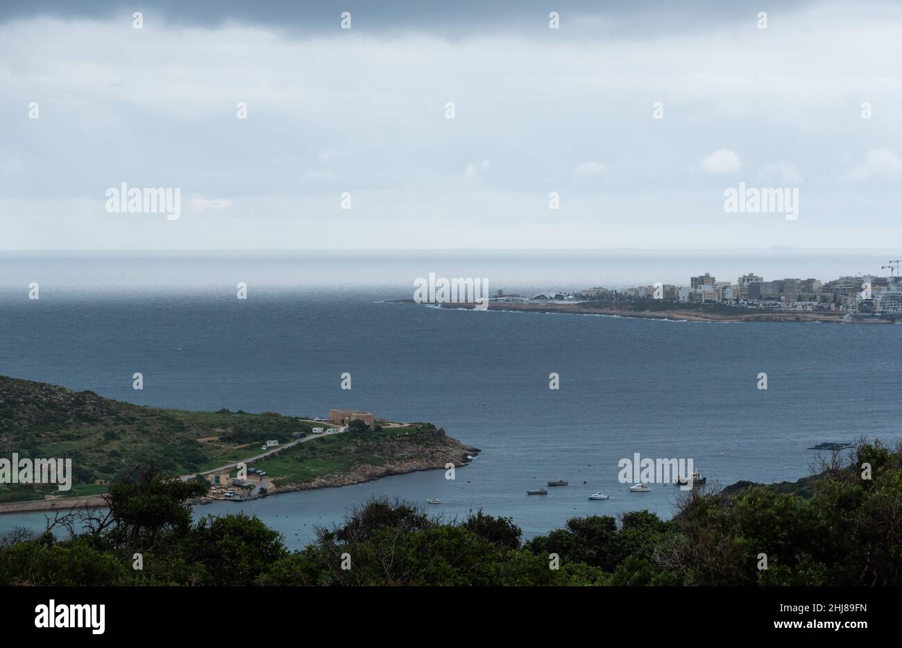 High angle view over the bay and shore of Melliena, as taken from Fort Campbell, Selmun, Malta Stock Photo