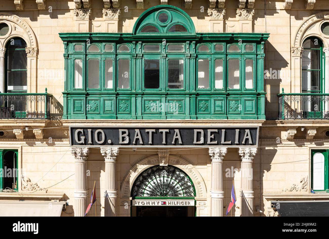 Valletta, Malta - 01 06 2022: Geen and yellow facade with bow window of a  fashion shop Stock Photo - Alamy