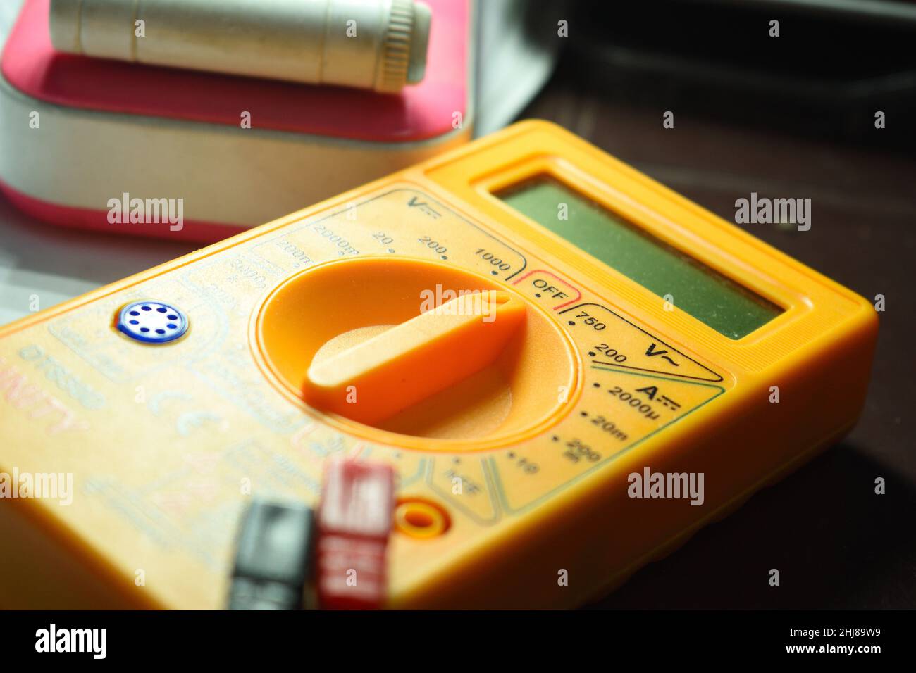 A small digital micrometer. A multimeter is an electronic measuring instrument that combines several measurement functions in one unit. Stock Photo