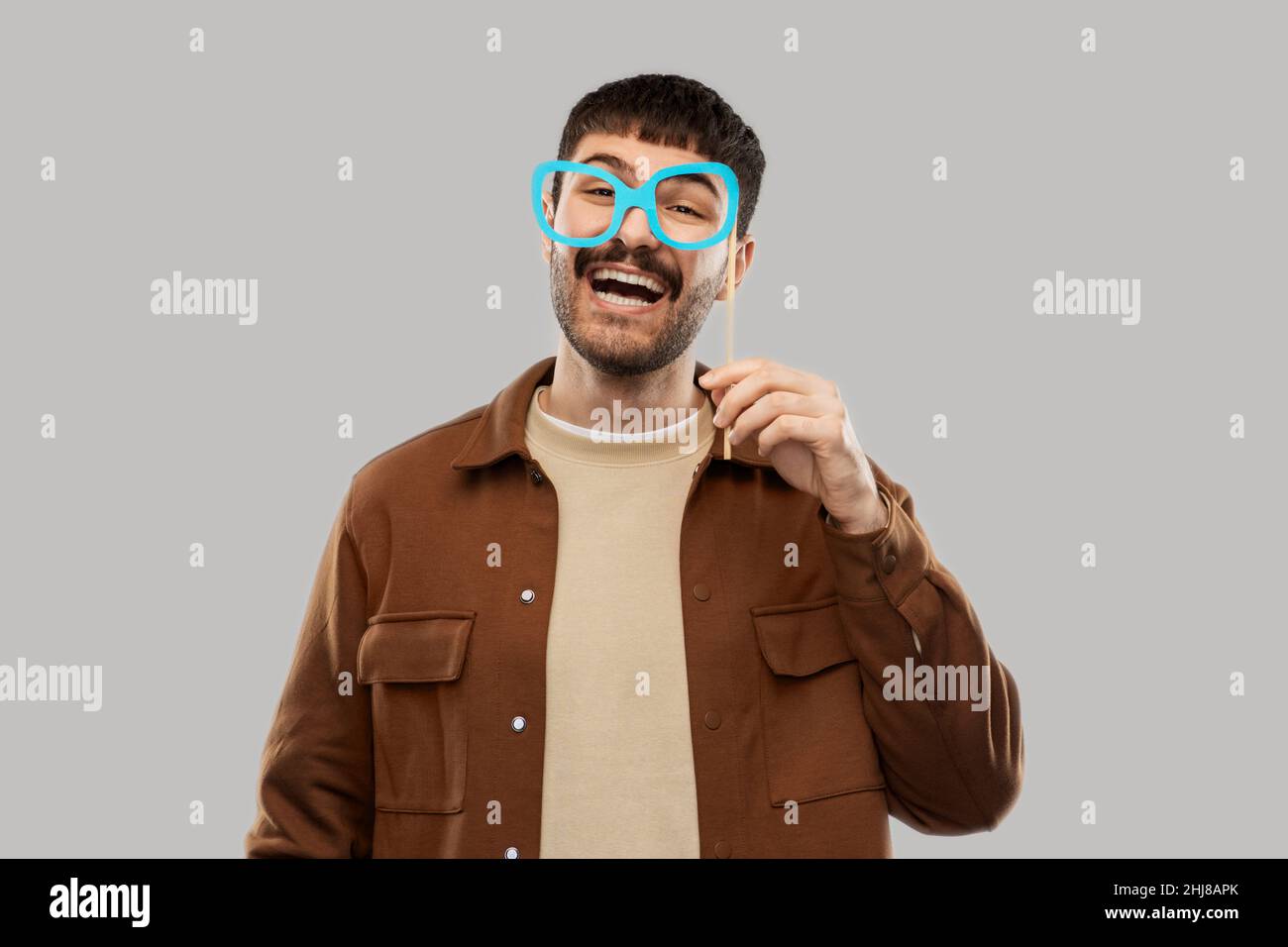 happy smiling man with glasses party accessory Stock Photo