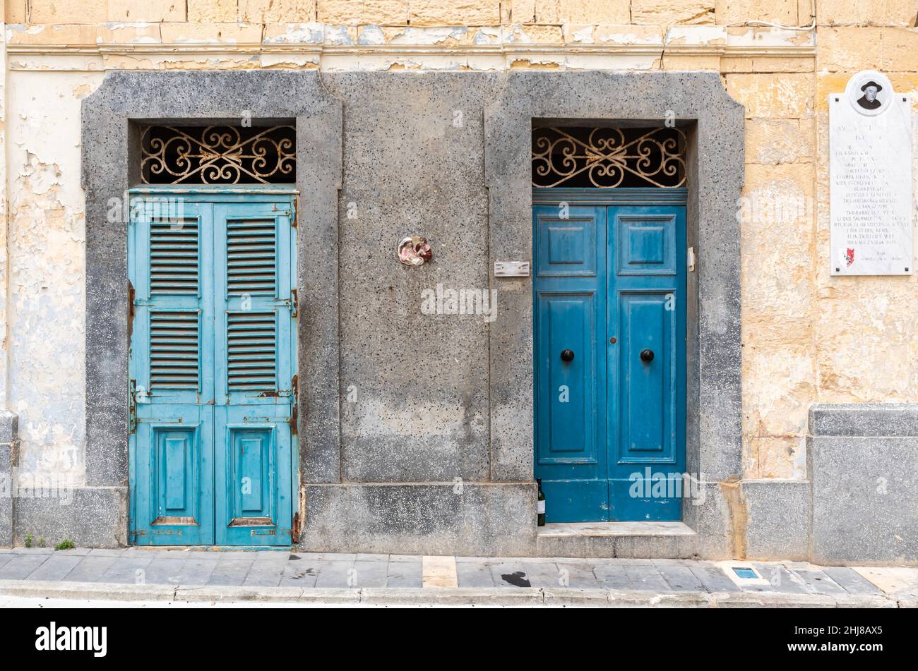 Rabat, Malta 01 07 2022 Worn wooden blue doors of traditional