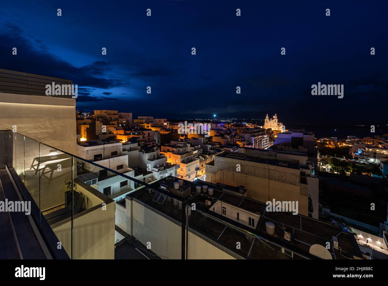 Mellieha, Malta - 01 07 2022: Ultra wide angle view from above from the Solona hotel and the bay by night Stock Photo