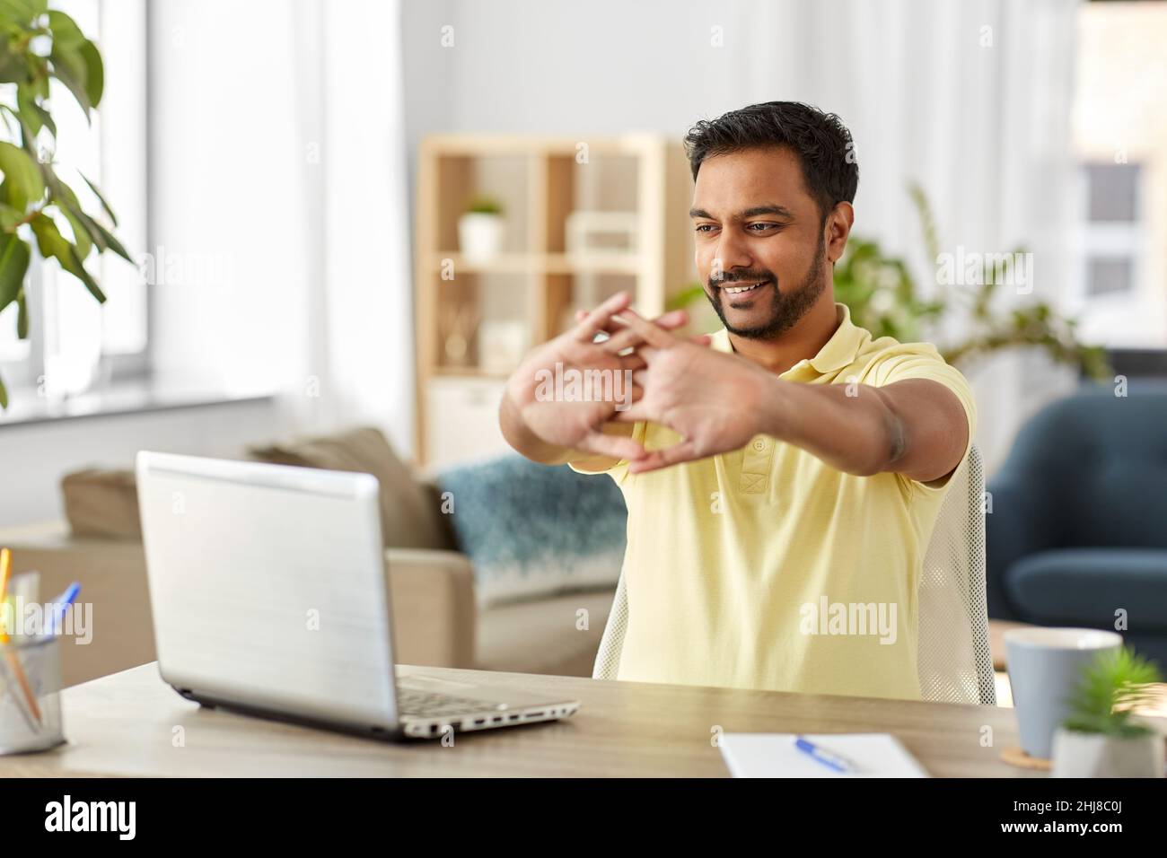 Businessman sitting table stretching hi-res stock photography and ...