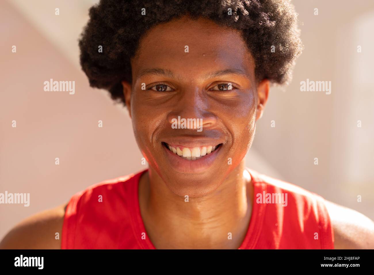 Closeup portrait of cheerful african american young man. unaltered