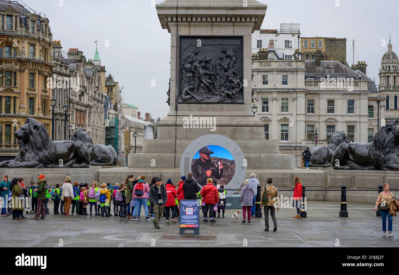 London, UK. 27 January 2022. Schoolchildren visit the live Greenpeace portal feed in Trafalgar Square broadcasting live from the Antarctic Stock Photo