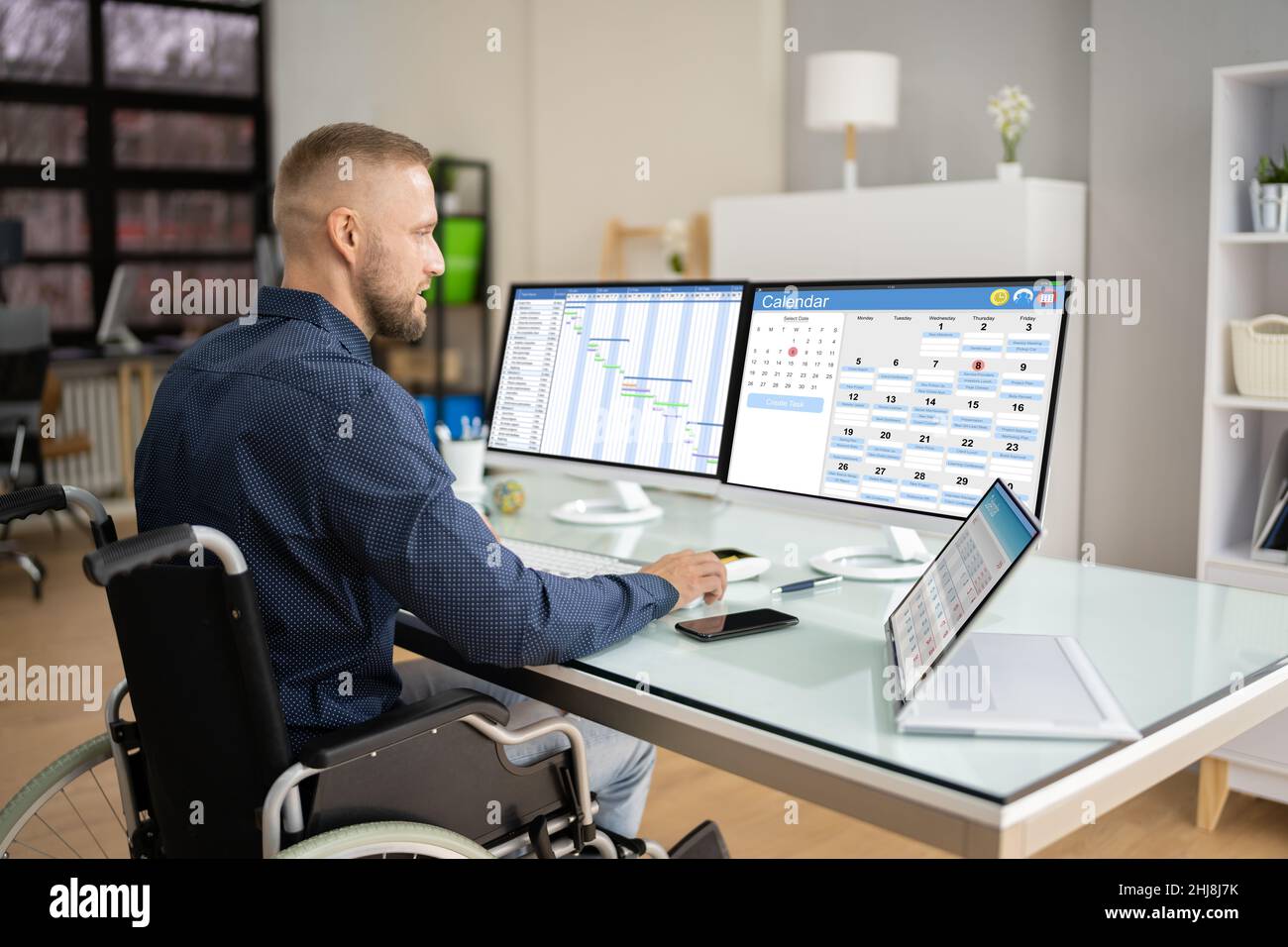 Employee Working On Calendar Schedule And Staff Time Sheet Stock Photo