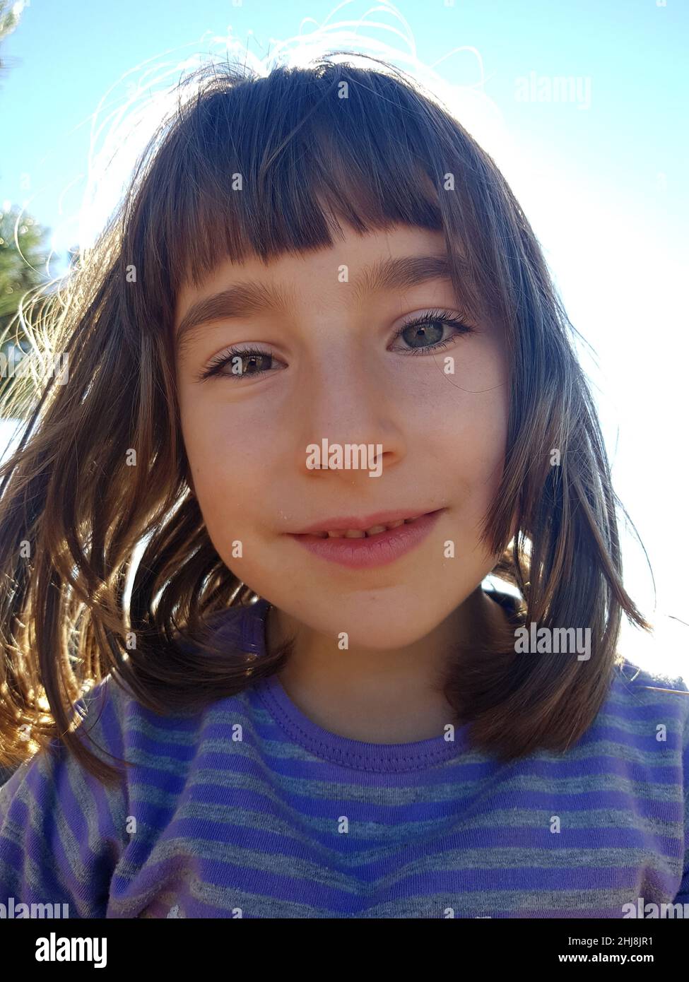 Portrait of a beautiful smiling young girl in the outdoors Stock Photo ...