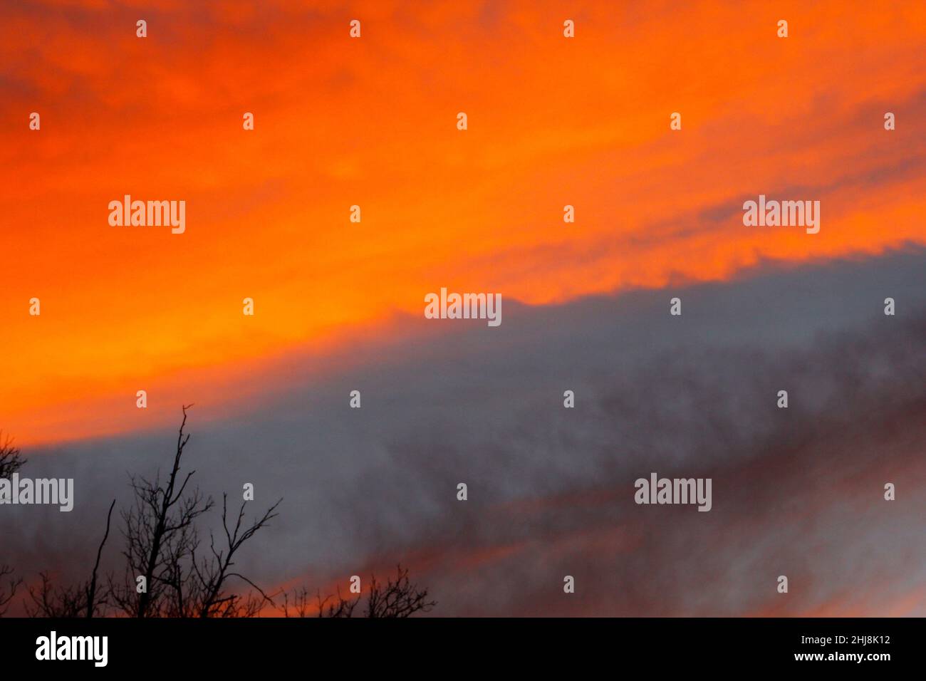 Fiery Looking Clouds at Sunset in Winter Stock Photo