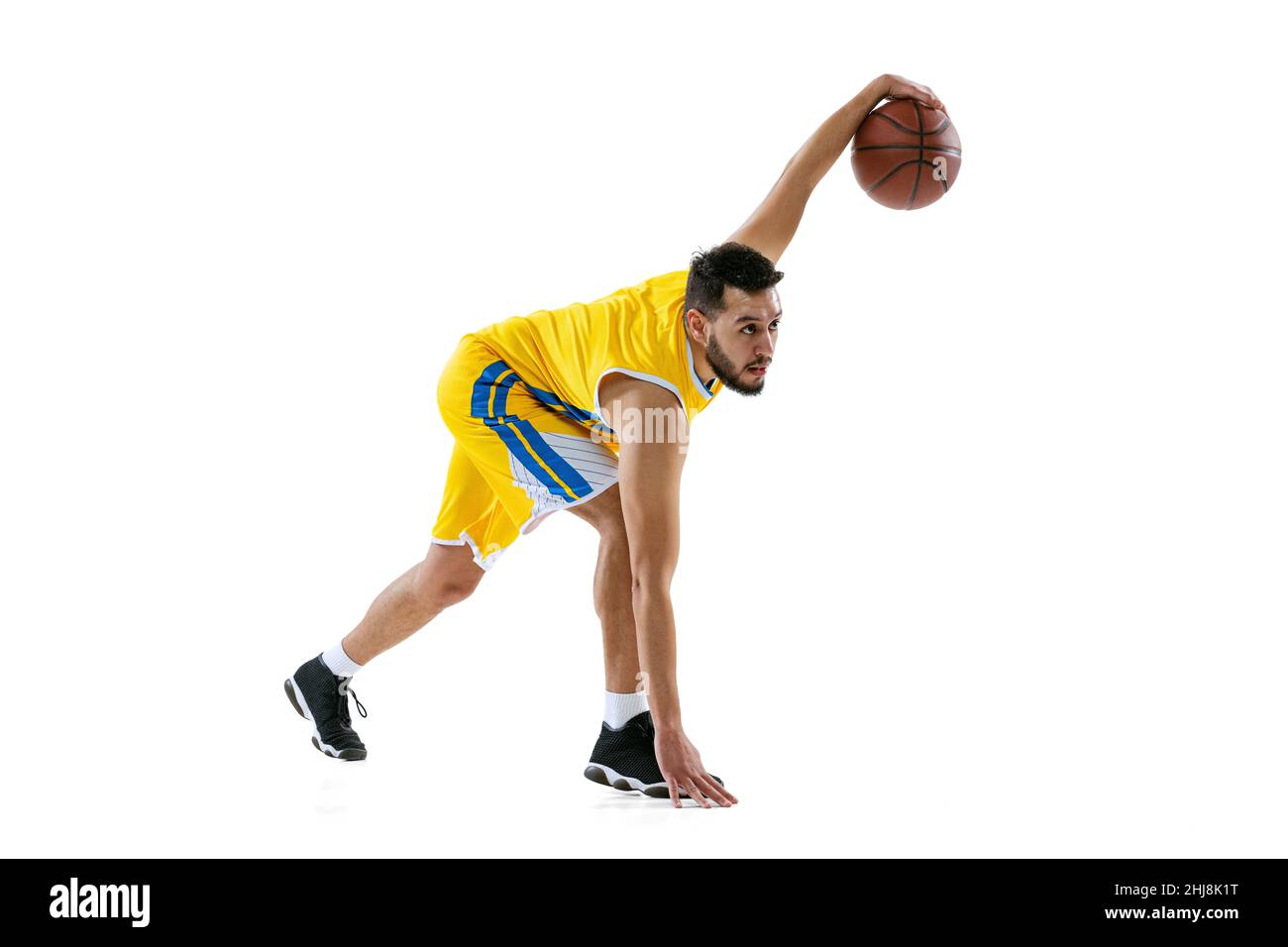 Full length portrait of professional basketball player training