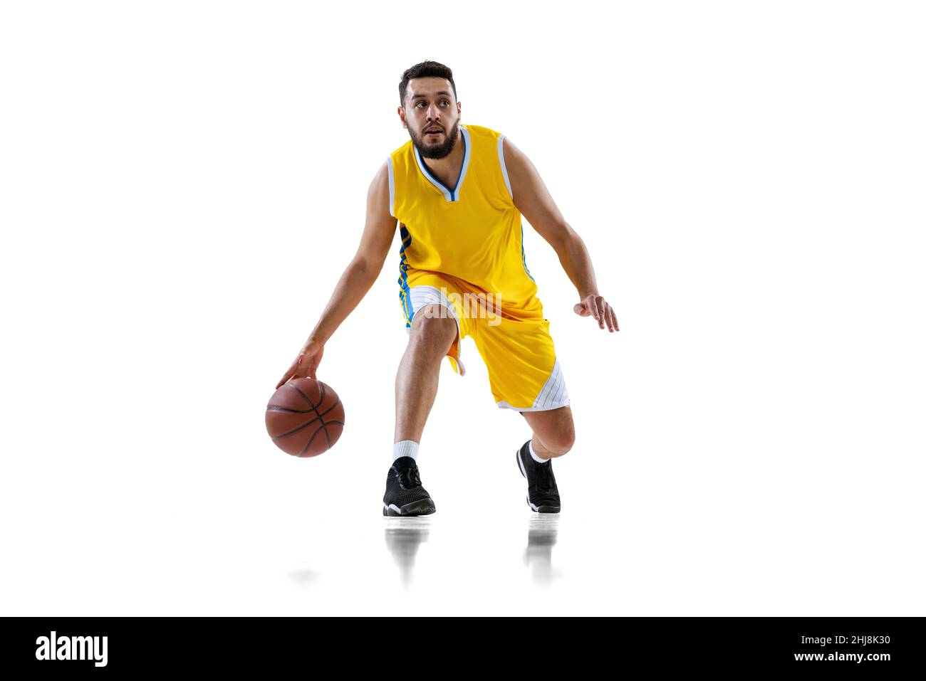 Full length portrait of professional basketball player training