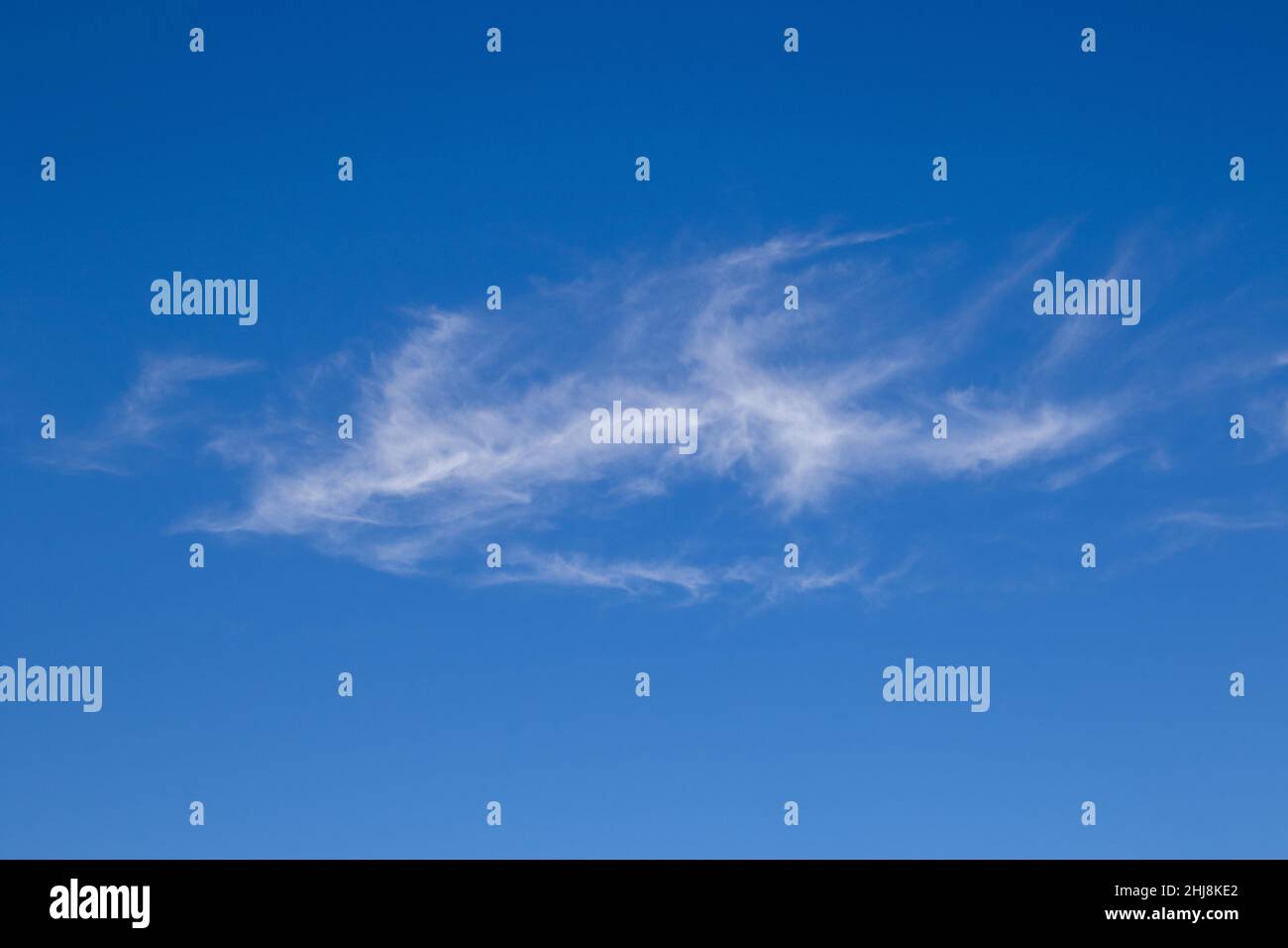 Shapes formed by white clouds in a blue sky Stock Photo - Alamy