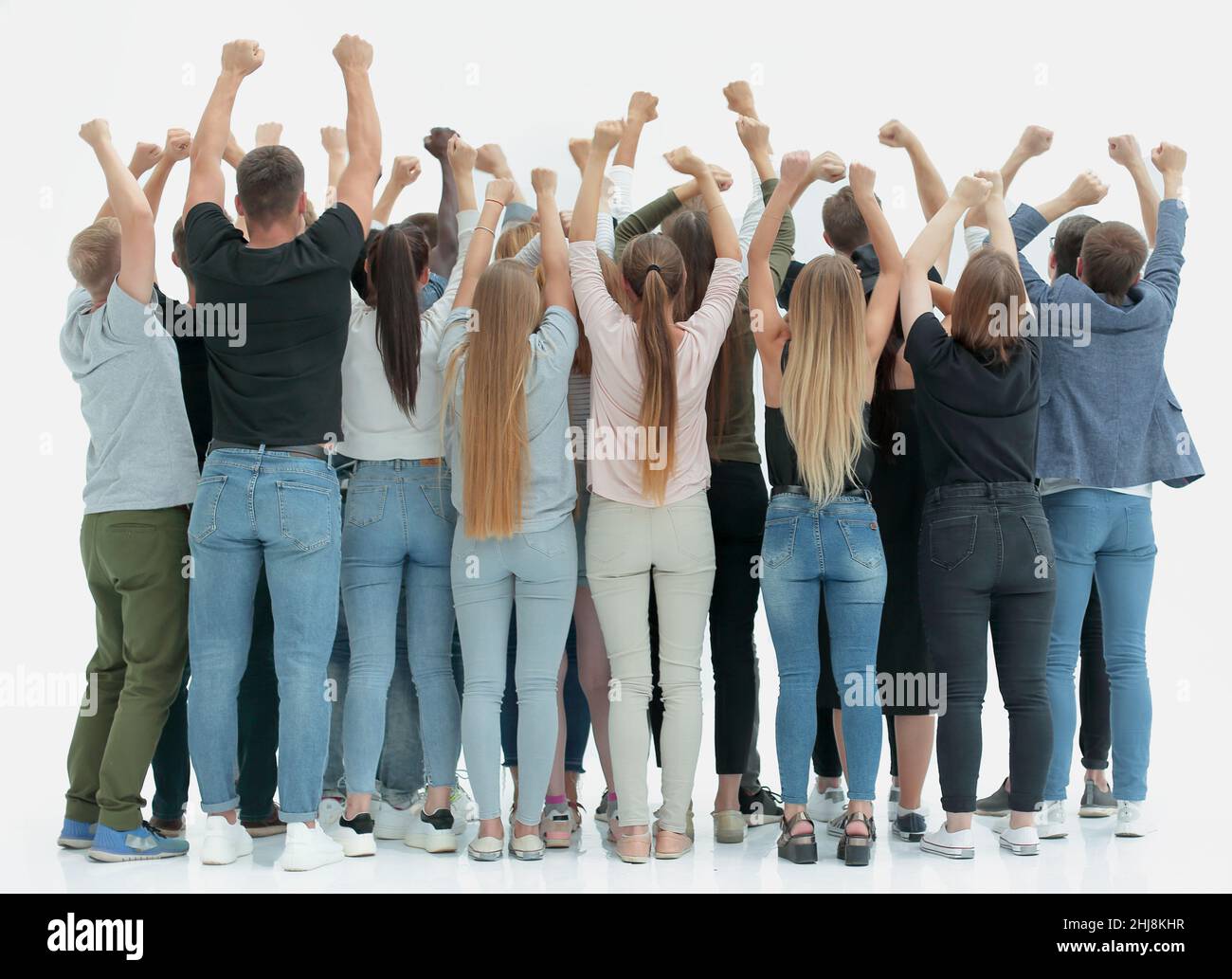 team of happy young people standing with hands up Stock Photo - Alamy