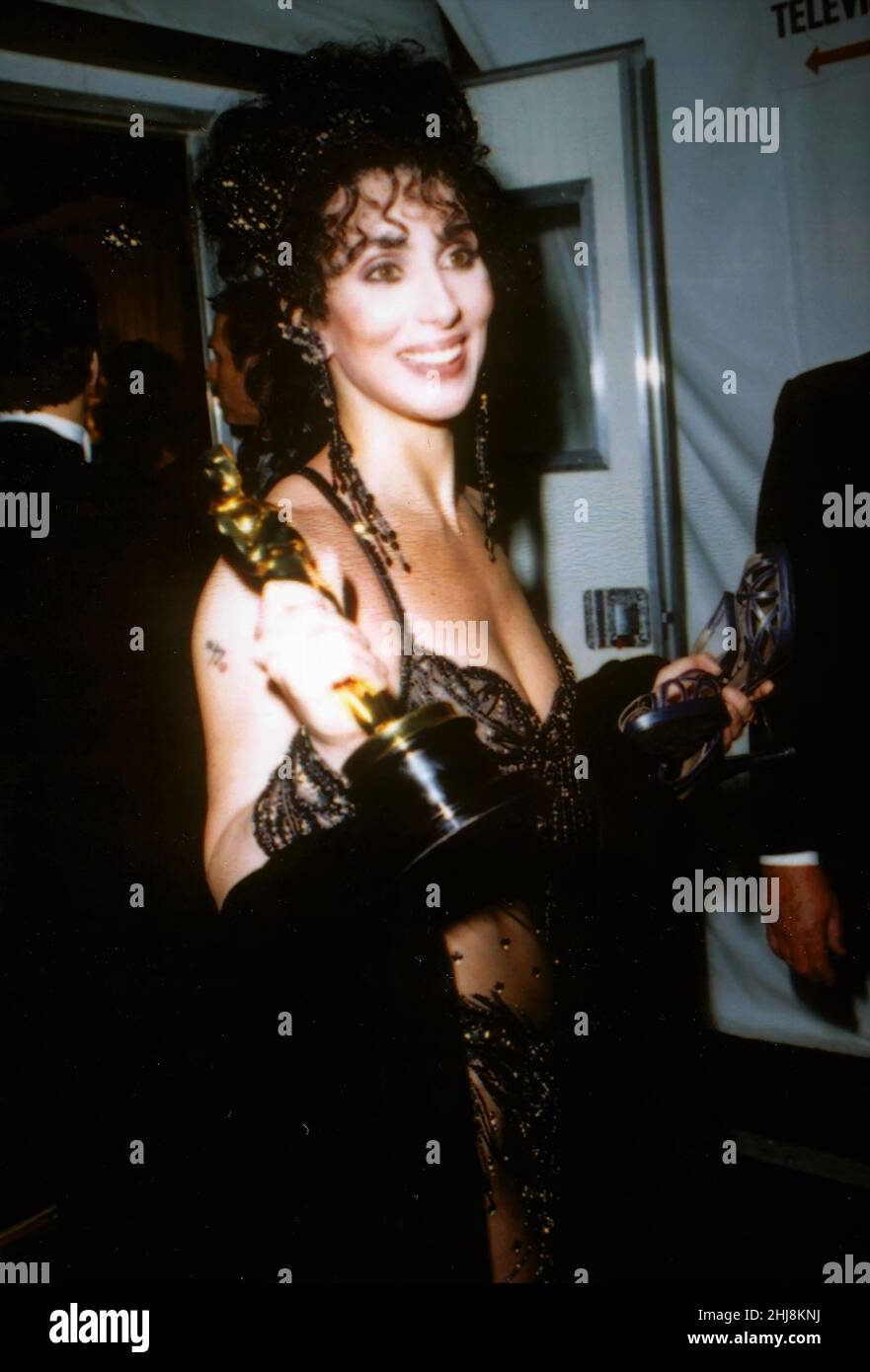 Cher at the Academy Awards for Best Actress for Moonstruck, 1988. Credit: Ron Wolfson / Rock Negatives / MediaPunch Stock Photo